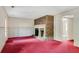 Spacious living room showcasing brick fireplace, and ample natural light at 1055 Heather Ct, Lawrenceville, GA 30043