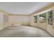 Spacious living room featuring large bay windows and neutral carpeting at 1055 Heather Ct, Lawrenceville, GA 30043