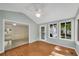 Sunroom with hardwood flooring and great natural light coming through the windows at 1055 Heather Ct, Lawrenceville, GA 30043