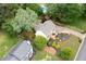 Beautiful home with lush landscaping, mature trees, and an inviting pool area for outdoor enjoyment at 1470 Rhododendron Nw Dr, Acworth, GA 30102