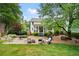 Gorgeous home with a sprawling backyard, patio, and manicured lawn perfect for outdoor living at 1470 Rhododendron Nw Dr, Acworth, GA 30102