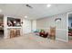 Finished basement area featuring a small bar with stools, carpeted flooring, and neutral walls at 1470 Rhododendron Nw Dr, Acworth, GA 30102