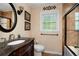 Elegant bathroom featuring a carved vanity, a walk-in shower and warm neutral tones at 1470 Rhododendron Nw Dr, Acworth, GA 30102