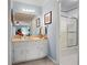 Updated bathroom with a large mirror, white vanity, and separate shower/tub area at 1470 Rhododendron Nw Dr, Acworth, GA 30102