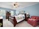 Inviting bedroom with a cozy quilt, ceiling fan, and large windows, creating a relaxing atmosphere at 1470 Rhododendron Nw Dr, Acworth, GA 30102