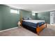 Basement bedroom with a queen-size bed, small windows and neutral carpeting at 1470 Rhododendron Nw Dr, Acworth, GA 30102