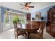 Traditional dining room featuring an oval table, blue walls, chandelier and bay window with decorative plates above at 1470 Rhododendron Nw Dr, Acworth, GA 30102