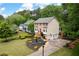 Lovely home with great curb appeal and well maintained yard surrounded by mature trees in quiet neighborhood at 1470 Rhododendron Nw Dr, Acworth, GA 30102