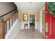 Bright foyer with tile flooring, staircase, and view into another room at 1470 Rhododendron Nw Dr, Acworth, GA 30102