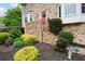 Inviting entrance with brick steps, bay windows, and vibrant landscaping at 1470 Rhododendron Nw Dr, Acworth, GA 30102