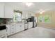 Bright, updated kitchen featuring white cabinets, stainless steel appliances, granite countertops, and a garden view at 1470 Rhododendron Nw Dr, Acworth, GA 30102