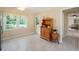 Bright kitchen with white trim and tile floor, natural wood furniture, and a view of the backyard at 1470 Rhododendron Nw Dr, Acworth, GA 30102