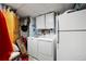 Practical laundry room with cabinets, washer, dryer, and extra refrigerator for added convenience at 1470 Rhododendron Nw Dr, Acworth, GA 30102