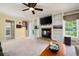 Spacious living room with a fireplace, built-in shelving, and view to the backyard at 1470 Rhododendron Nw Dr, Acworth, GA 30102