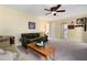 Comfortable living room with neutral carpet, wood-paneled walls, and ample seating at 1470 Rhododendron Nw Dr, Acworth, GA 30102