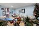 Cluttered room featuring tables, a sewing machine and some wall decorations at 1470 Rhododendron Nw Dr, Acworth, GA 30102