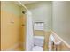 Bathroom featuring a shower with updated tile, a toilet, and storage shelves at 2425 Maclaren Cir, Dunwoody, GA 30360