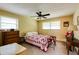 Serene bedroom featuring natural light, a ceiling fan, and classic furnishings at 2425 Maclaren Cir, Dunwoody, GA 30360