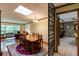 Sunlit dining room featuring a large window, wooden table set, and stylish decor at 2425 Maclaren Cir, Dunwoody, GA 30360