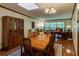 Bright dining room with hardwood floors, wooden table set, and a large window view at 2425 Maclaren Cir, Dunwoody, GA 30360