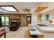 Open concept kitchen with a brick fireplace, center island, and tile flooring at 2425 Maclaren Cir, Dunwoody, GA 30360