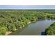 Overhead shot of the lake with a treelined shore at 5159 Sw East Shore Sw Dr, Conyers, GA 30094