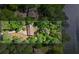 Aerial view of a wooded lot featuring mature trees and water access, with property lines for clarity at 5159 Sw East Shore Sw Dr, Conyers, GA 30094