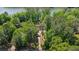 Aerial view of a wooded property featuring lake access, mature trees, and a tranquil setting at 5159 Sw East Shore Sw Dr, Conyers, GA 30094