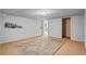 Basement area includes neutral carpeting, a rug, and whimsical forest art at 5159 Sw East Shore Sw Dr, Conyers, GA 30094