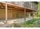 Walkout basement with painted concrete floor, access to backyard, and a rocking chair at 5159 Sw East Shore Sw Dr, Conyers, GA 30094