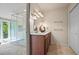Bathroom with glass-enclosed shower, tiled floor, and a vanity with storage at 5159 Sw East Shore Sw Dr, Conyers, GA 30094