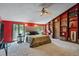 Bedroom with large windows, decorative lighting, and built-in shelving at 5159 Sw East Shore Sw Dr, Conyers, GA 30094