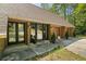 Home exterior featuring dark trim windows and doors, plus a two-car garage at 5159 Sw East Shore Sw Dr, Conyers, GA 30094
