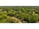 Aerial view of neighborhood with green landscaping and scattered homes at 783 Britt Sw Rd, Mableton, GA 30126