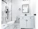This stylish bathroom features a vanity with black hardware, a mirror, and a tiled shower at 783 Britt Sw Rd, Mableton, GA 30126