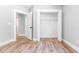 Bedroom showing a walk-in closet with hanging storage, LVP flooring and neutral paint at 783 Britt Sw Rd, Mableton, GA 30126