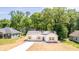 Charming one-story home with a blue door, white exterior, and front lawn at 783 Britt Sw Rd, Mableton, GA 30126