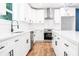 This bright, modern kitchen features white cabinetry and stainless steel appliances at 783 Britt Sw Rd, Mableton, GA 30126