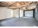 Unfinished basement area with exposed ceiling insulation and concrete flooring at 1213 Anderson Mill Rd, Austell, GA 30106