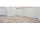 Spacious basement featuring modern flooring, neutral paint, and a door to another room at 1213 Anderson Mill Rd, Austell, GA 30106