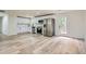 Modern kitchen featuring white cabinets, stainless steel appliances, and wood-look floors at 1213 Anderson Mill Rd, Austell, GA 30106