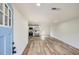 Open-concept living space featuring wood-look floors and modern kitchen with stainless steel appliances at 1213 Anderson Mill Rd, Austell, GA 30106