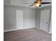 Neutral bedroom with carpet, a ceiling fan, and two closets offering ample storage space at 1511 Harbor Watch Ct, Woodstock, GA 30189
