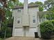 Exterior view of a house with a garage and an adjacent wooden deck at 1511 Harbor Watch Ct, Woodstock, GA 30189