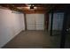 Spacious unfinished garage offering potential for storage or hobbies at 1511 Harbor Watch Ct, Woodstock, GA 30189