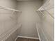 Spacious walk-in closet with wire shelving at 1511 Harbor Watch Ct, Woodstock, GA 30189