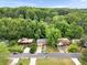 Aerial street view showing the property among the neighborhood with lush trees, lawns, and paved streets at 1563 Greenwood Dr, Norcross, GA 30093