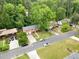 Aerial view showing the property in a suburban neighborhood with mature trees and well-maintained lawns at 1563 Greenwood Dr, Norcross, GA 30093