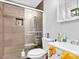 Bathroom featuring a tiled shower with glass door at 1563 Greenwood Dr, Norcross, GA 30093