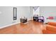 Bedroom featuring wood floors, neutral paint, and a window at 1563 Greenwood Dr, Norcross, GA 30093